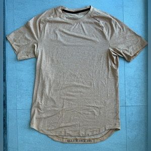 License to train orange Lululemon shirt